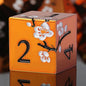 Orange Metal Dice D&D, DNDND 7 PCS Heavy Metallic DND Dice Set with Gorgeous Gift Case for Dungeons and Dragon Tabletop Game (Orange with White Flowers)
